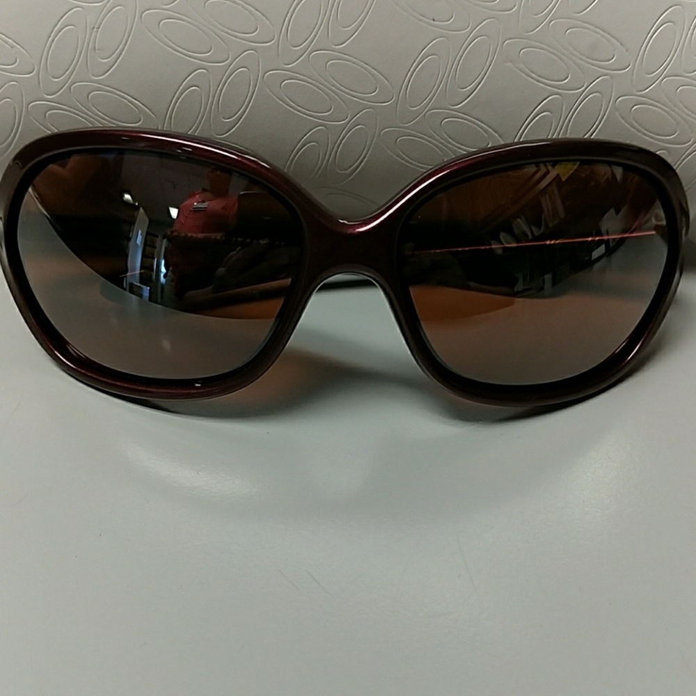 Plum/wine colored Oakley sunglasses